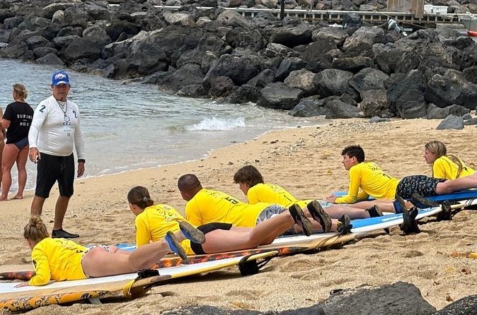 60 to 90 minutes Open Book Surfing Lesson with Certified Guide - Small Groups (Max 4) and Coaching That Gets You Standing