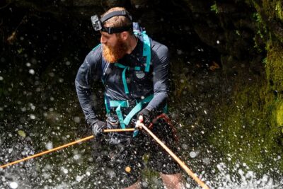 Chasing Waterfalls:Wild Hawaii Rappelling - At the waterfall: harness and rope setup before anyone goes down