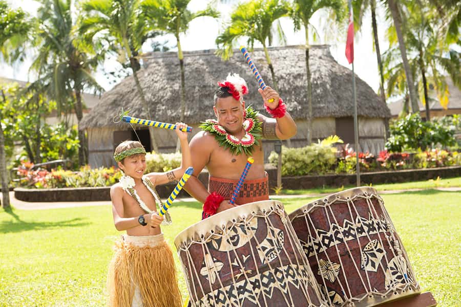 Oahu: Islands of Polynesia and "HA: Breath of Life Show" - Fiji Village and the Canoe Pageant on the water with the derua