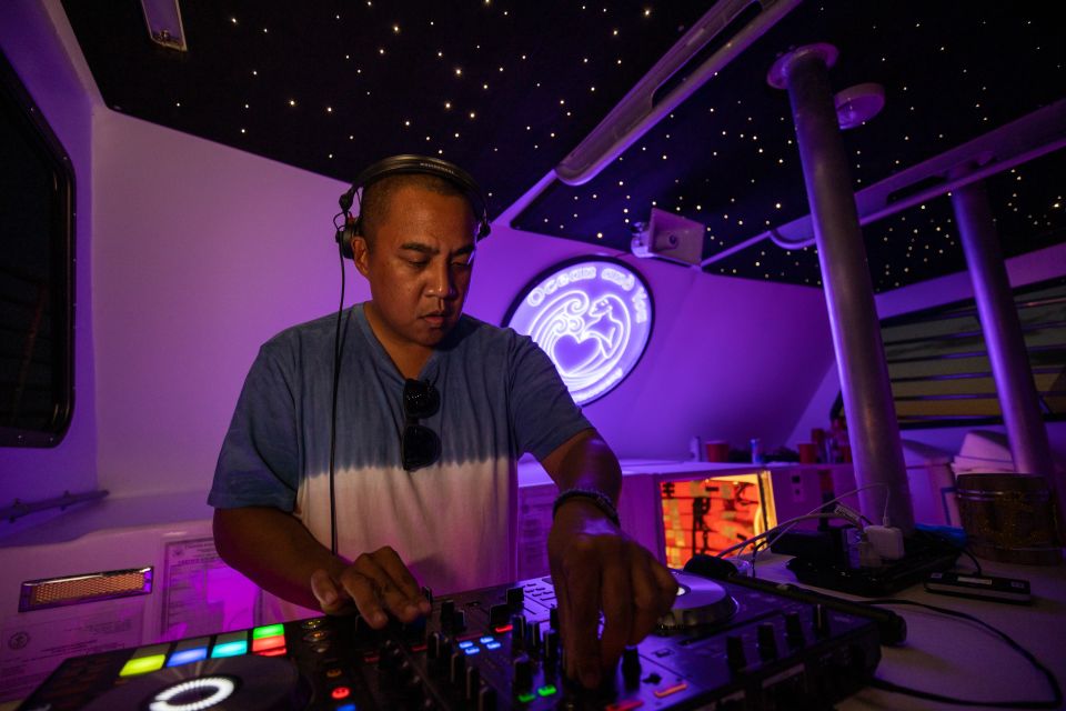 Oahu: Premium Waikiki Sunset Party Cruise with Live DJ - After dark: purple lights, skyline sparkle, and non-stop DJ energy