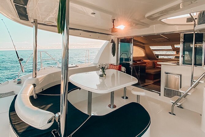 Private Oahu Sunset Charter with Tasting and Drinks - Sunset Channel anchor stop: feet in the Pacific and real sky time