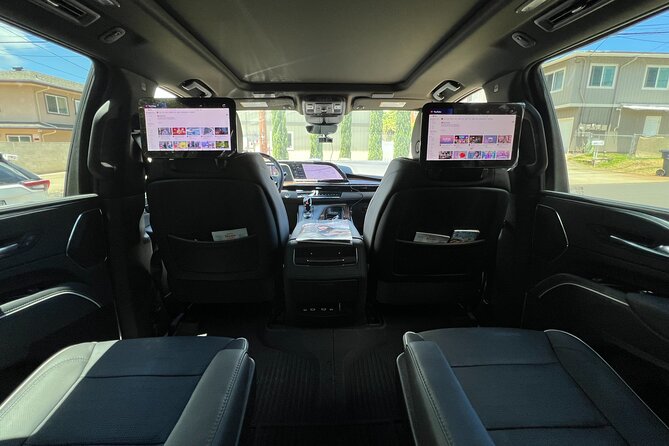 VIP Luxury Transfers: Honolulu Airport ↔ Waikiki ↔ Cruise Port - Inside the luxury vehicle: Wi‑Fi, rear TVs, bottled water, and what that means in real life